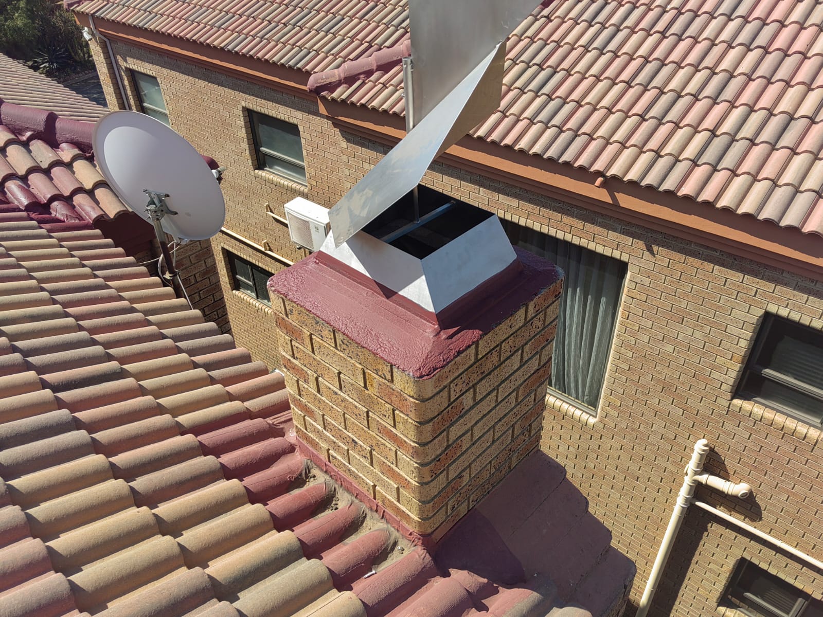 Chimney flashing on a tiled roof