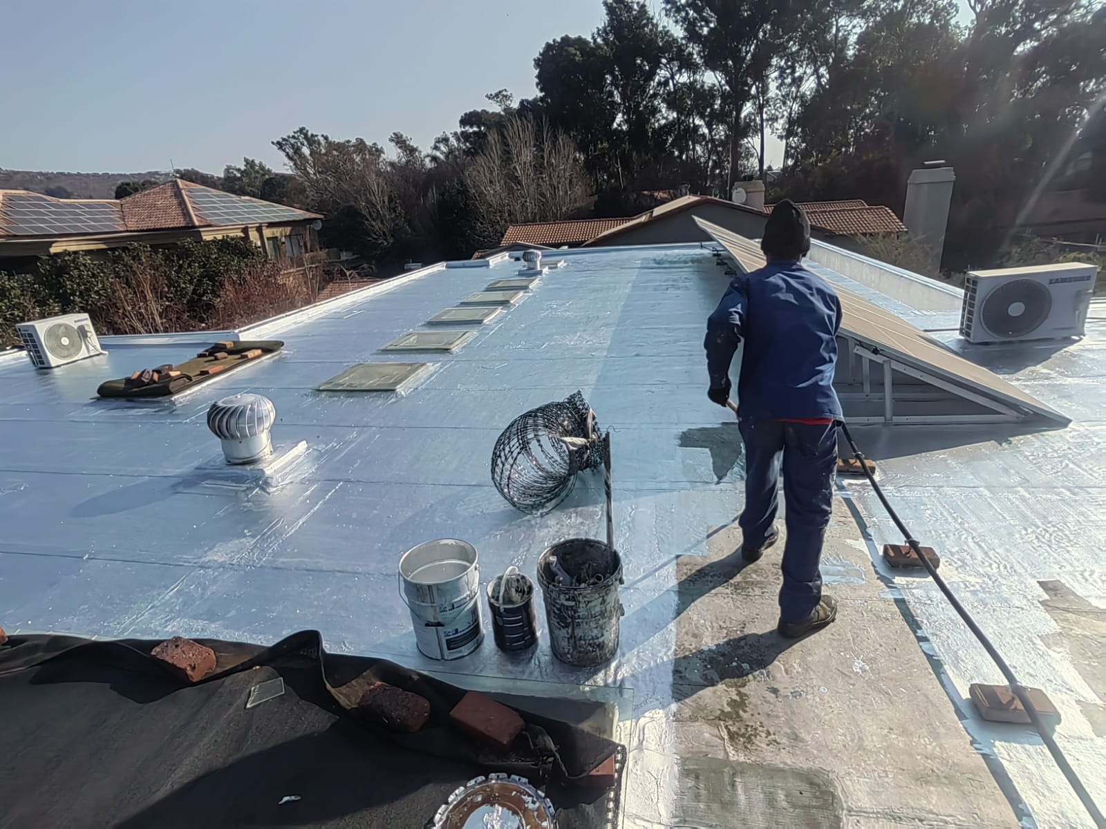 Waterproofing being applied to a flat roof