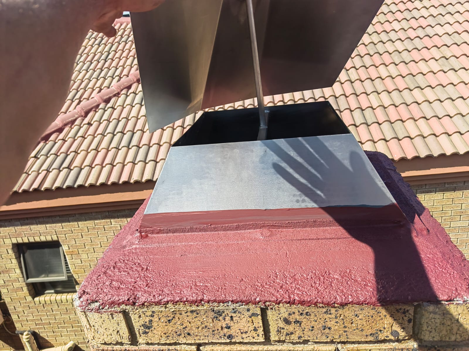 Skylight flashing repaired on a tiled roof
