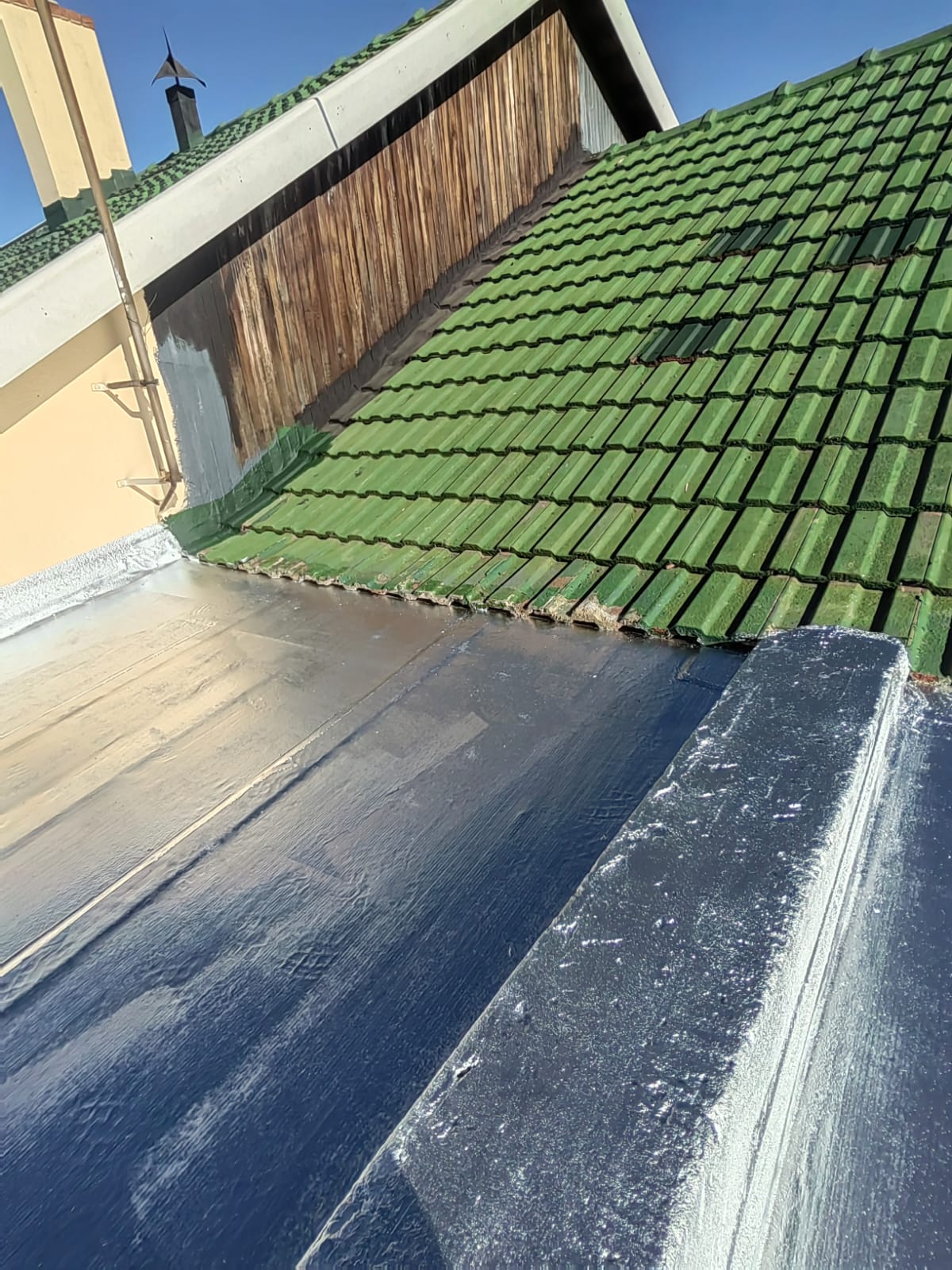 Waterproofed valley flashing on a tiled roof